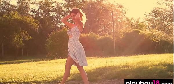  All natural teen Lillii stripping slowly on a meadow